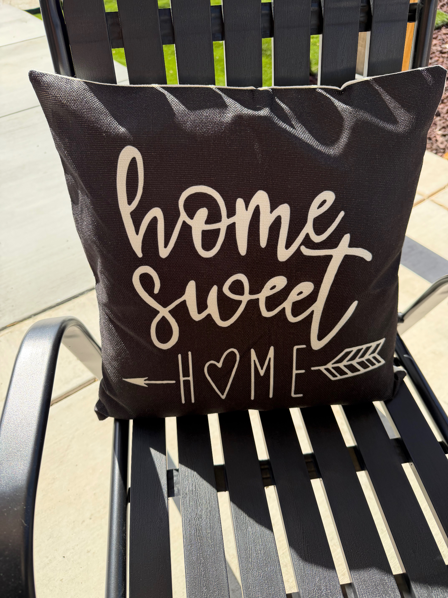 Home Sweet Home accent pillow on the outdoor patio